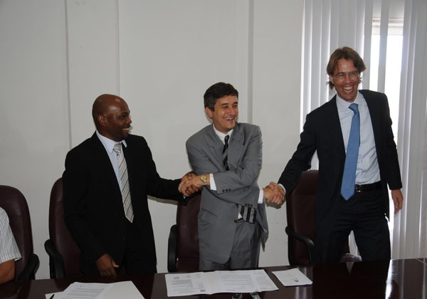 Commissioner Heyliger signs USONA agreement for school information system.