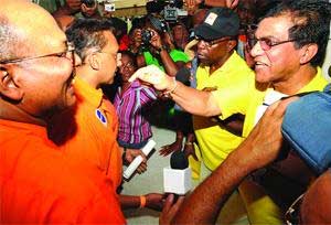clash at rienzi: Deputy Political Leader Jack Warner, second from right, and Tabaquite MP Ramesh Lawrence Maharaj, right, argue with senior officers at the UNC's National Congress, Rienzi Complex, Couva, yesterday. Supporters of Warner and Maharaj clashed violently with UNC stalwarts when they were prevented from entering the Congress. clashatrienzis
