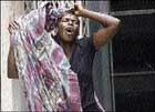This woman mourns the death of businessman Cecil Riley of Albion, St Thomas, on Tuesday. gvm