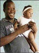 Jerome Fleming with his seven-month-old daughter, Tianna, at the Mothers of Incarcerated Sons centre. - Photo by Amitabh Sharma jeromeflemingandd
