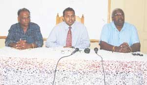 From left to right: Director of Sports, Neil Kumar, Minister of Culture, Youth and Sports, Dr. Frank Anthony and Permanent Secretary Keith Booker at the head table. (A Lawrence Fanfair photograph). tguys