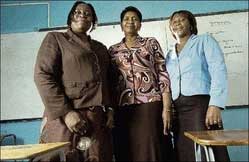 From left: Carol Jennings-Smith, Curline Christie and Jacquelin Greenland stand in the environment they have made home for their students - a classroom at St Andrew Technical High School. - (Ricardo Makyn/Staff Photographer) threewomen