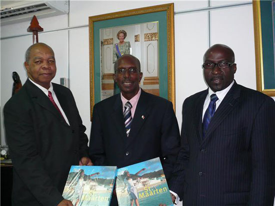 Mr. Sydney Paulina, Former Acting Managing Director Nieuwe Post Nederlandse Antillen N.V., Governor Franklyn E. Richards, Mr. Franklin sluis, New Managing Director Nieuwe Post Nederlandse Antillen N.V. post
