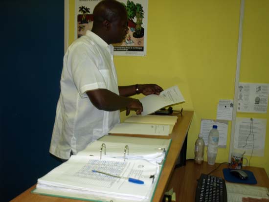 Commissioner Laveist looks at letters prior to making delivery. snd