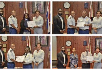 Police Officers and Detectives Receive Certificates During Recognition Ceremony.