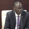 Minister Richinel Brug defends actions amid integrity allegations as parliament adjourns debate over healthcare concerns.