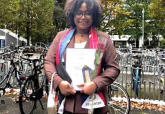 MP Lyndon Lewis congratulates Terryanne Tondu on her Academic Achievements